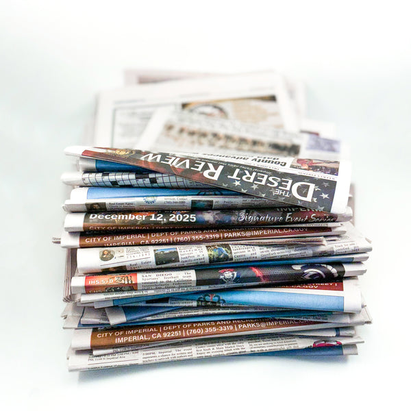 Stack of newspapers on a white background